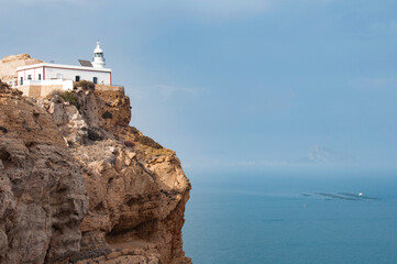 Fototapeta na wymiar ALBIR, SPAIN - AUGUST 11, 2012: A Lighthouse and exhibition center within a marine conservation area, with sea views and clifftop trails.