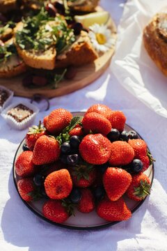 Plate with ripe strawberries