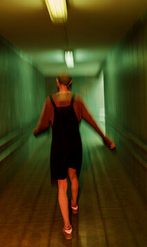 Androgyne Woman with short hair walking away