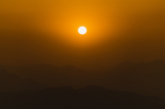 Orange Sunset And Mountains Silhouettes