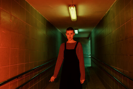 Androgyne Woman with short hair smoking