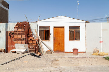 A humble little house of the local Paracas inhabitants, unpainted and with some lack of...