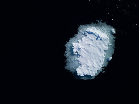 Greenland sea ice island, small island of seaice melting, climate change effects