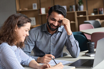 Two happy diverse business people professional employees workers having discussion working together having fun at office meeting. Indian teacher and latin student having friendly conversation. - obrazy, fototapety, plakaty