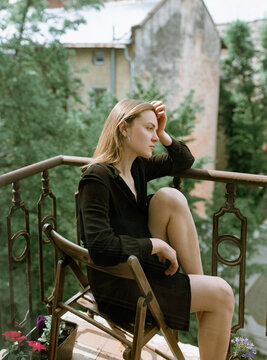 Young woman relaxing on a balcony