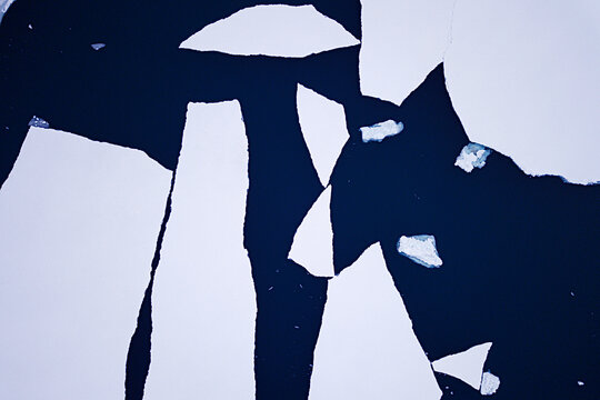 Greenlandic sea-ice cracking and disappearing, melting into warming oceans