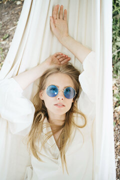Happy woman resting in hammock