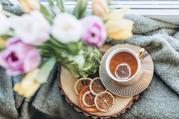 top view still life vase of flowers and a cup of coffee