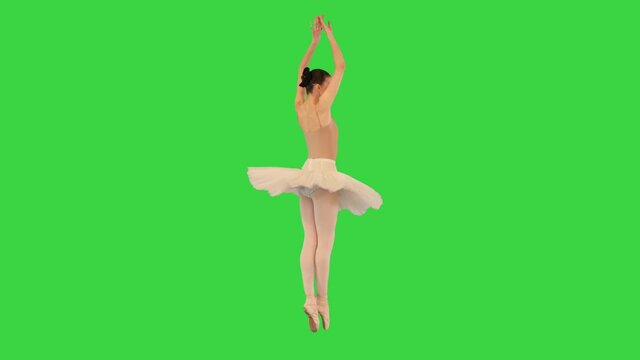Ballerina makes spins on her tiptoes and runs away on a Green Screen, Chroma Key.