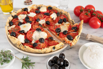 Homemade tomato pie with black olives and cheese