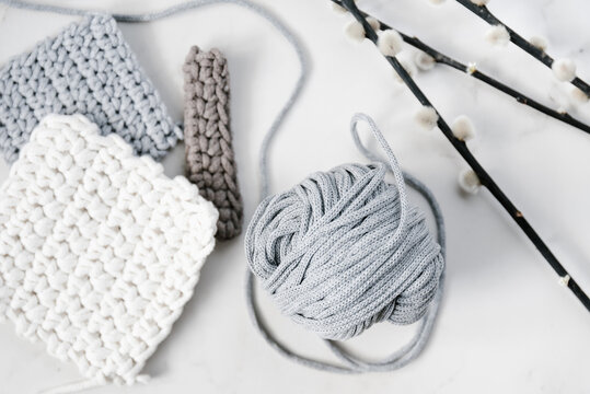 Knitted patterns and yarn on table