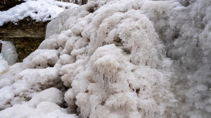 Dauda waterfall in winter. Small Frozen waterfall in Gauja national park, Sigulda, Latvia.