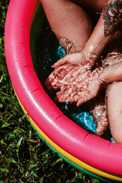 woman in a small plastic pool