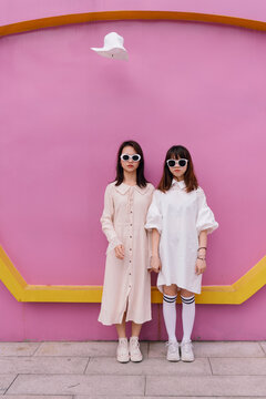 funny portrait of two fashionable women