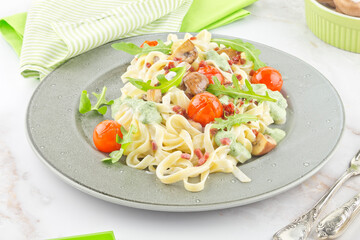 Tagliatelle pasta with rocket pesto mushrooms and ham series image 01
