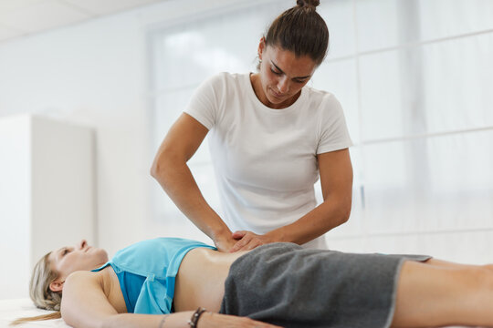 Physiotherapy doing a massage to a woman