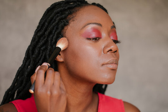 Beautiful Black Woman Applying Make Up