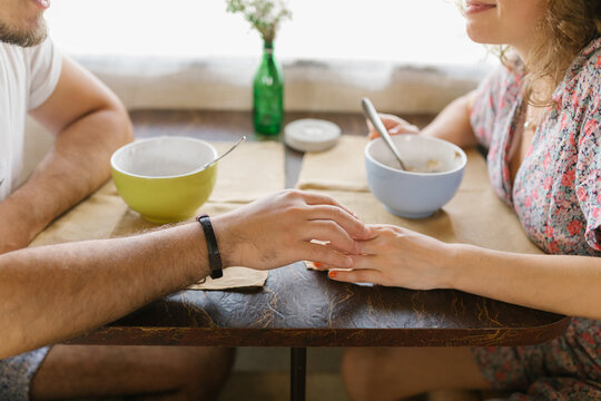 Young couple having breakfast in a trailer