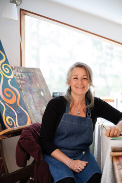 Mature woman portrait in her home loft studio.