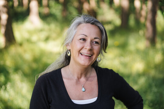 Mature, healthy woman outside enjoying life.