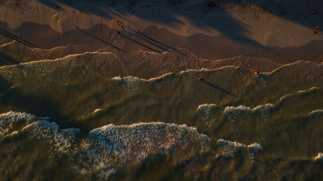 Waves of the ocean running slowly on the coast, calm sea.