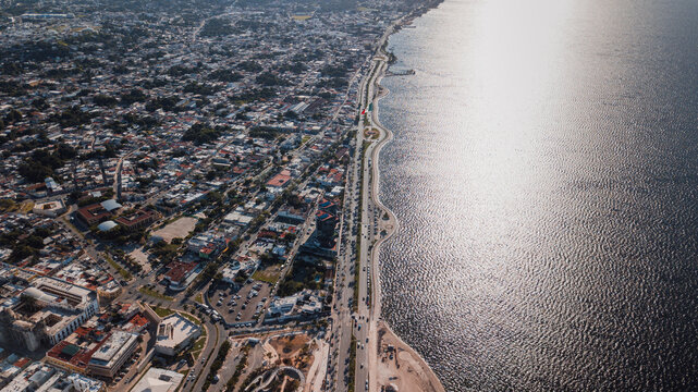 Mazatlan cityscape drone shot. Long embankment along the sea.