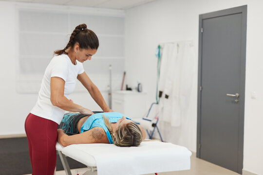Physiotherapy doing a massage to a woman