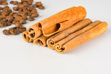 Aromatic cinnamon sticks and roasted coffee beans. Selective focus. ..