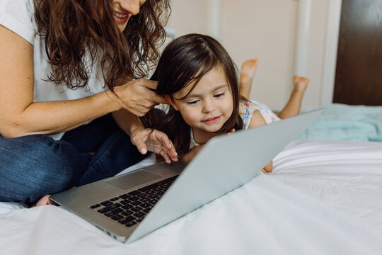Mother and daughter with a laptop
