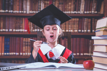 Young beautiful female master signing an employment contract. Humorous photo.