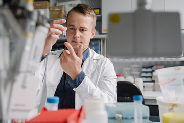 Man Analyzing A Sample In A Laboratory
