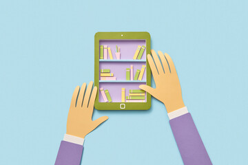Papercraft e-book with educational library in hands.