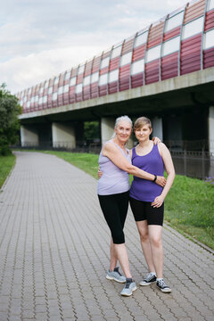 Grandmother and granddaughter at a joint outdoor training session.