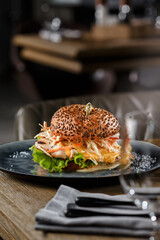 Chicken Burger with coleslaw on wooden table