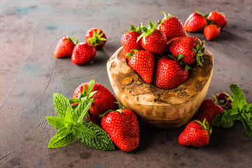 Berries colorful assorted mix of strawberry, blueberry, raspberry, blackberry on dark background