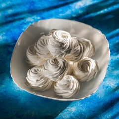 White Marshmallow On A Plate On A Sunny Day