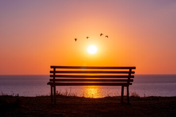 Bench with sea view at sunset, Sicily island, Italy