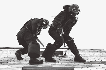 Two commandos train at the base. Climbers. SWAT, police, counterterrorism concept.