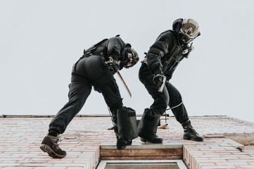 Two commandos train at the base. Climbers. SWAT, police, counterterrorism concept.