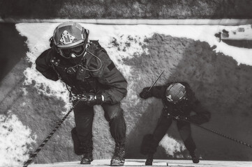 Two commandos train at the base. Climbers. SWAT, police, counterterrorism concept.