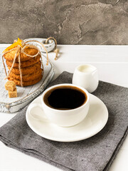 coffee with milk and orange cookies
