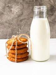 a bottle of milk and a slide of orange cookies
