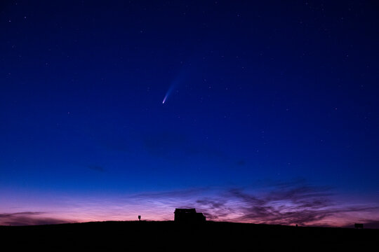 The comet Neowise streaks through the night sky