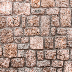 brown stone wall closeup, textured pattern, natural background