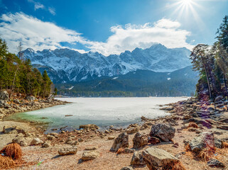 Winter view to the frozen lake and the Zugspitze at the background