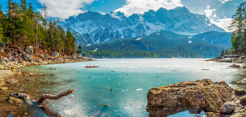 Winter view to the frozen lake and the Zugspitze at the background