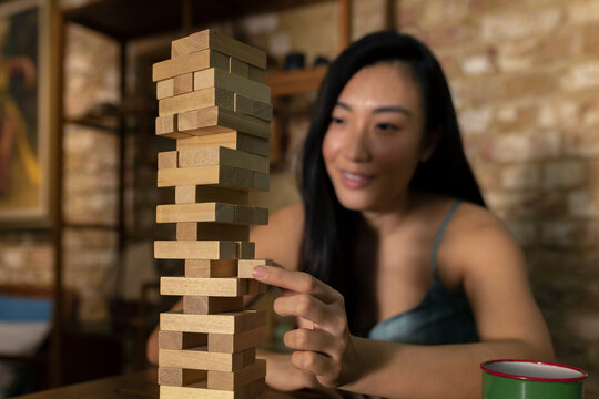 Couple playing Tumbling Towers