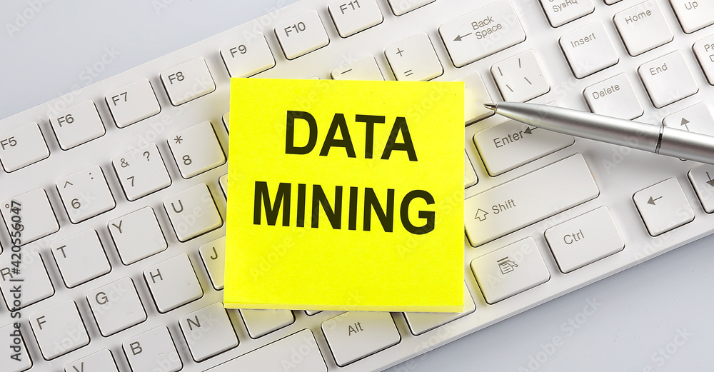 Poster words data mining written on stickers on a computer keyboard