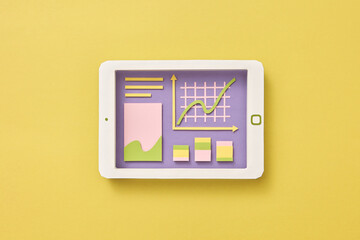 Papercraft tablet with graphic online presentation.