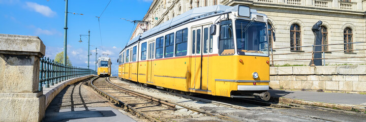 Fototapeta na wymiar Historic yellow trams in central Budapest